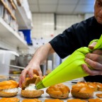 Dutch confectioner Arnold Cornelis makes orange pastries in his bakery on April 11, 2013 in Amsterdam, The Netherlands. Queen Beatrix announced on January 28, 2013 that she will abdicate and hand over the throne to Crown Prince Willem-Alexander on April 30. AFP PHOTO /ANP / REMKO DE WAAL
netherlands out - belgium out        (Photo credit should read REMKO DE WAAL/AFP/Getty Images)