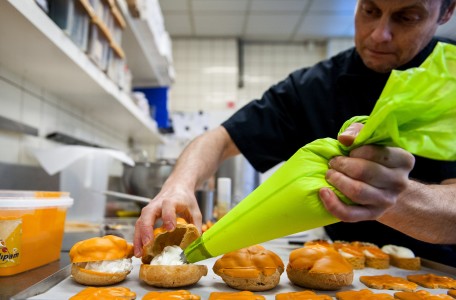 Dutch confectioner Arnold Cornelis makes orange pastries in his bakery on April 11, 2013 in Amsterdam, The Netherlands. Queen Beatrix announced on January 28, 2013 that she will abdicate and hand over the throne to Crown Prince Willem-Alexander on April 30. AFP PHOTO /ANP / REMKO DE WAAL
netherlands out - belgium out        (Photo credit should read REMKO DE WAAL/AFP/Getty Images)